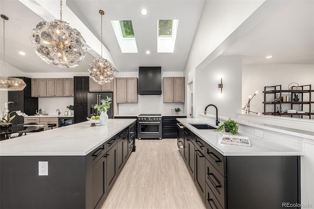 5401 E Dakota Ave Unit 22, Denver, CO 80246 - kitchen featuring appliances with stainless steel finishes, a large island with sink, custom range hood, a chandelier, and recessed lighting