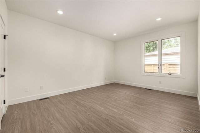 5401 E Dakota Ave Unit 22, Denver, CO 80246 - unfurnished room featuring wood finished floors and recessed lighting
