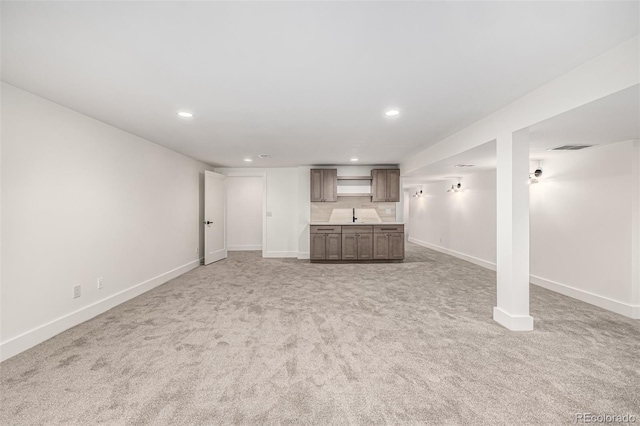 5401 E Dakota Ave Unit 22, Denver, CO 80246 - unfurnished living room featuring recessed lighting and light colored carpet
