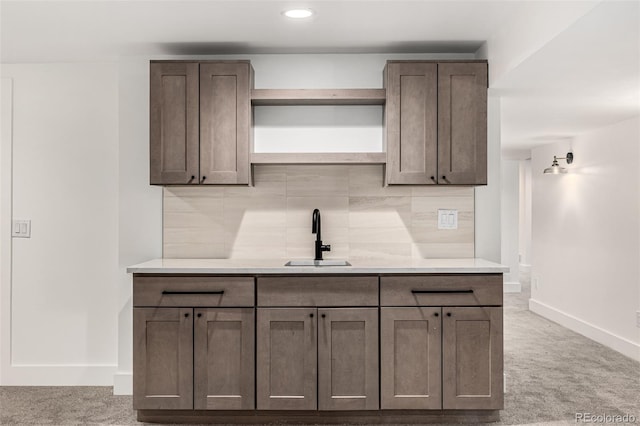 5401 E Dakota Ave Unit 22, Denver, CO 80246 - kitchen with decorative backsplash, open shelves, light countertops, light carpet, and recessed lighting