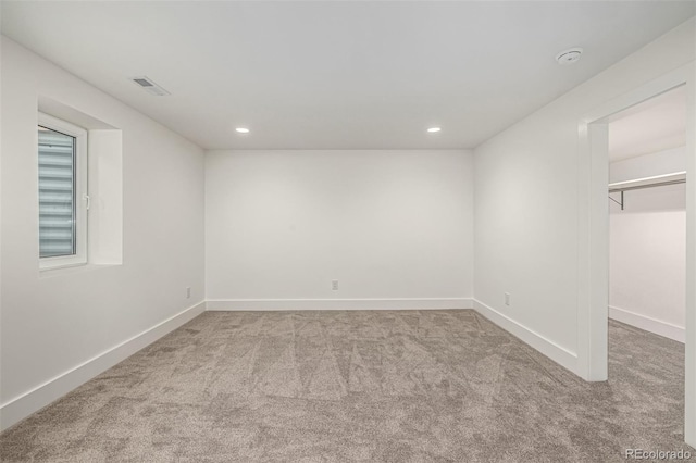 5401 E Dakota Ave Unit 22, Denver, CO 80246 - unfurnished bedroom featuring carpet floors, a spacious closet, and recessed lighting