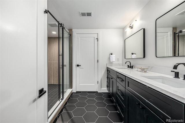 5401 E Dakota Ave Unit 22, Denver, CO 80246 - full bathroom featuring tile patterned floors, double vanity, and a shower stall