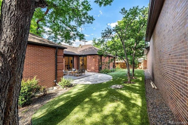 5401 E Dakota Ave Unit 22, Denver, CO 80246 - view of yard with a patio