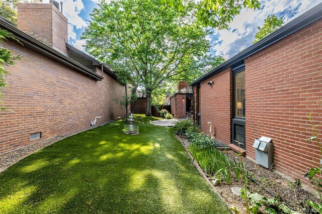 5401 E Dakota Ave Unit 22, Denver, CO 80246 - view of grassy yard with an outdoor structure