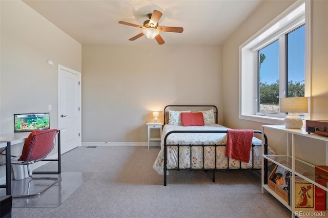 bedroom with ceiling fan and carpet