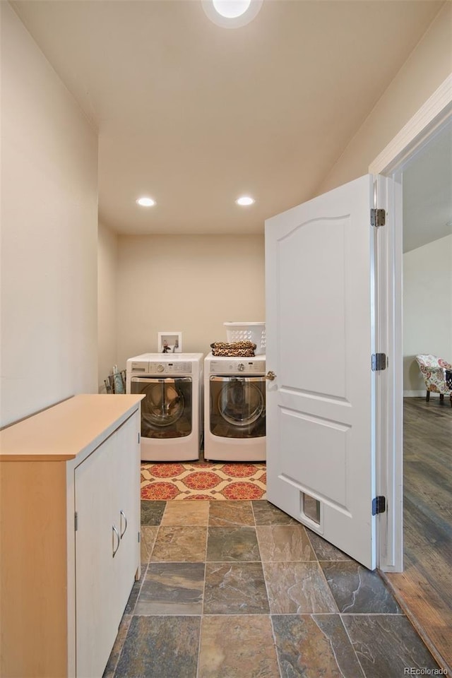 laundry area featuring independent washer and dryer and dark hardwood / wood-style flooring