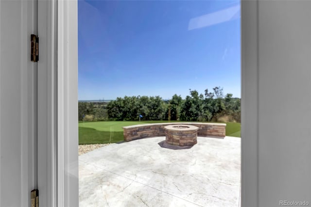 view of patio / terrace featuring a fire pit