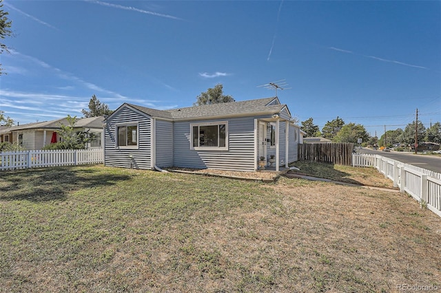 view of property exterior with a yard