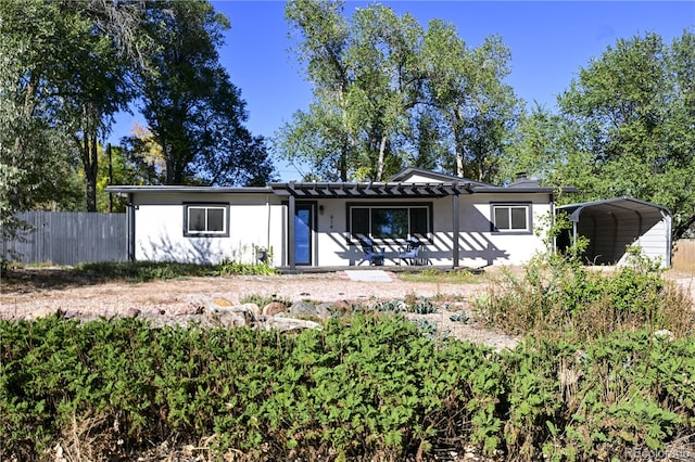 ranch-style home featuring a carport