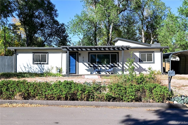 view of front facade with a carport