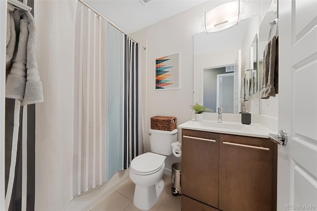 bathroom with vanity, tile patterned floors, toilet, and visible vents