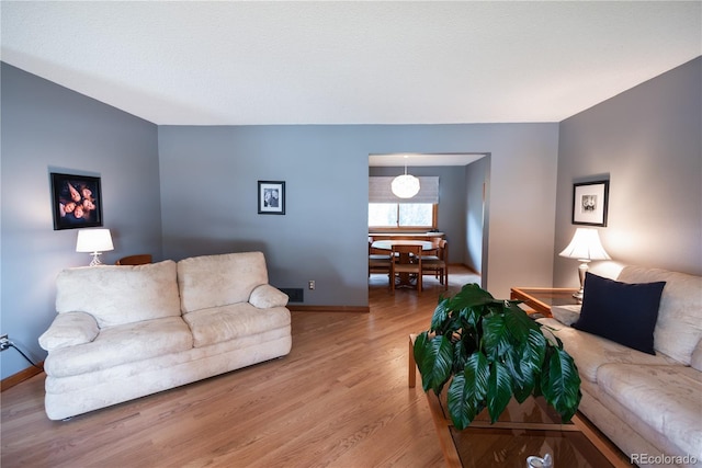 17530 E Caspian Pl, Aurora, CO 80013 - living area featuring wood finished floors and baseboards