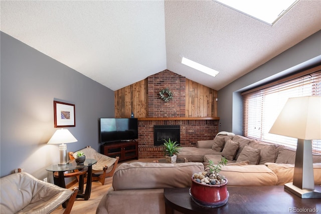 17530 E Caspian Pl, Aurora, CO 80013 - living area featuring lofted ceiling, wood finished floors, a skylight, wood walls, and a textured ceiling