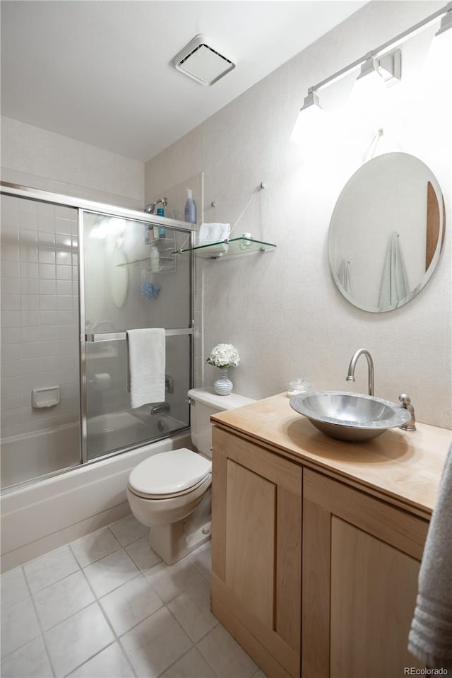 17530 E Caspian Pl, Aurora, CO 80013 - full bath with vanity, bath / shower combo with glass door, and tile patterned floors