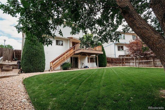 17530 E Caspian Pl, Aurora, CO 80013 - view of front facade featuring a fenced backyard, stairs, and a deck