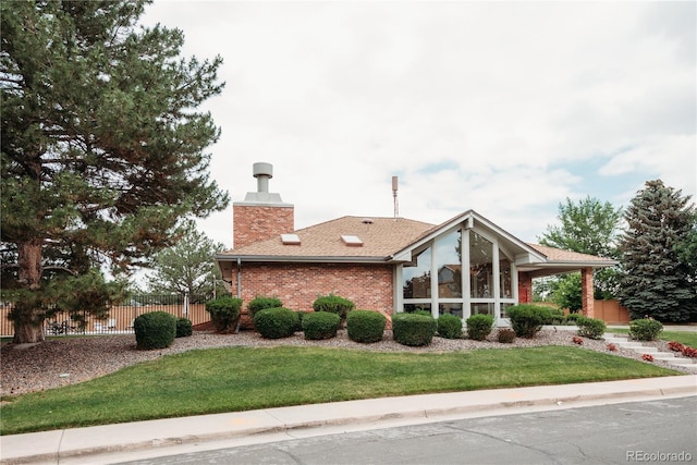 17530 E Caspian Pl, Aurora, CO 80013 - view of property exterior featuring a chimney and brick siding