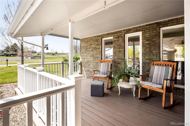 wooden deck featuring covered porch