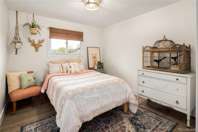bedroom featuring wood finished floors