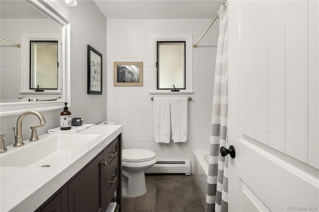 full bathroom featuring baseboard heating, vanity, toilet, tile patterned floors, and shower / tub combo