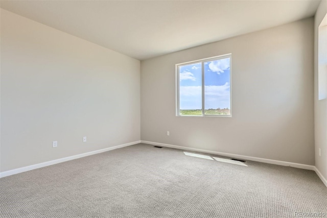 empty room with carpet flooring