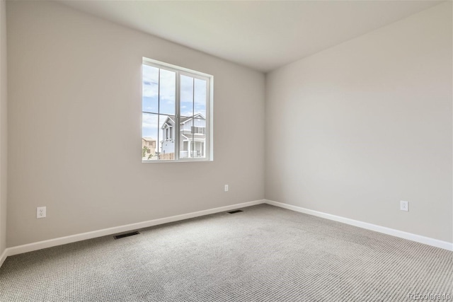 empty room featuring carpet flooring