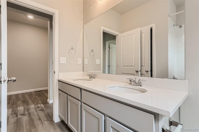 bathroom with vanity and hardwood / wood-style flooring