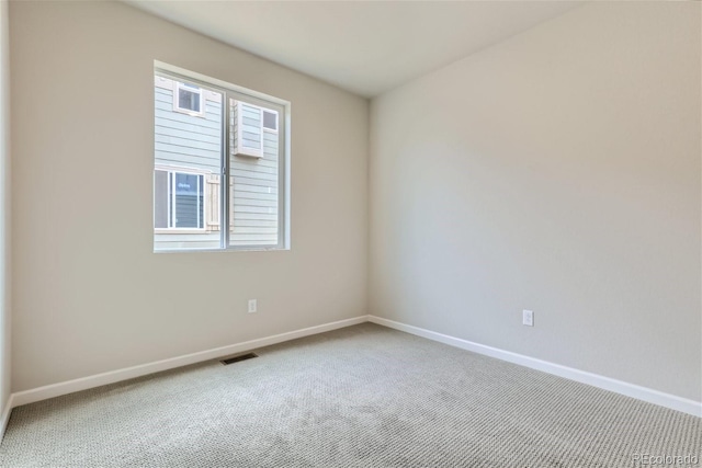 unfurnished room with carpet flooring