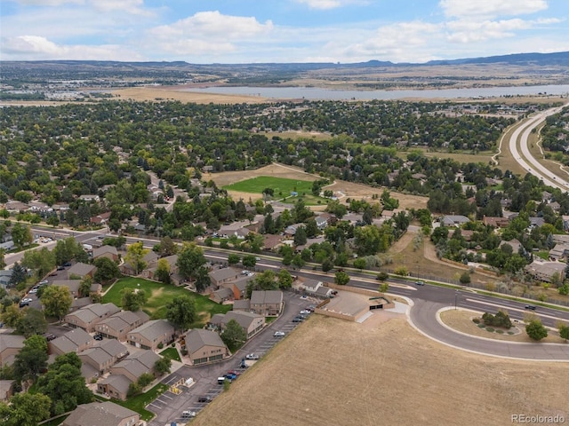 bird's eye view featuring a water and mountain view