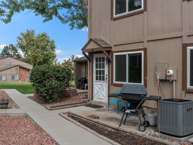 doorway to property featuring central AC