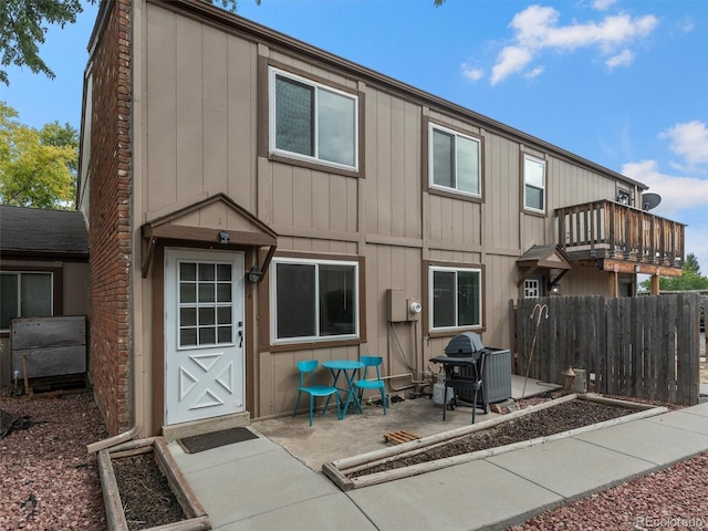 back of property with a patio area