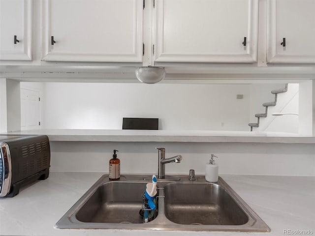 room details with sink and white cabinets