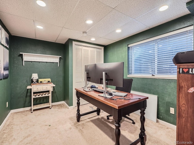 office area featuring carpet and a drop ceiling