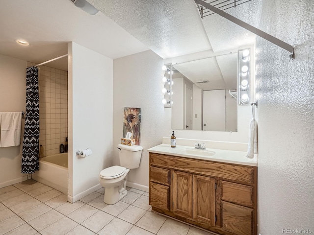 full bathroom with tile patterned flooring, vanity, shower / bath combo, and toilet