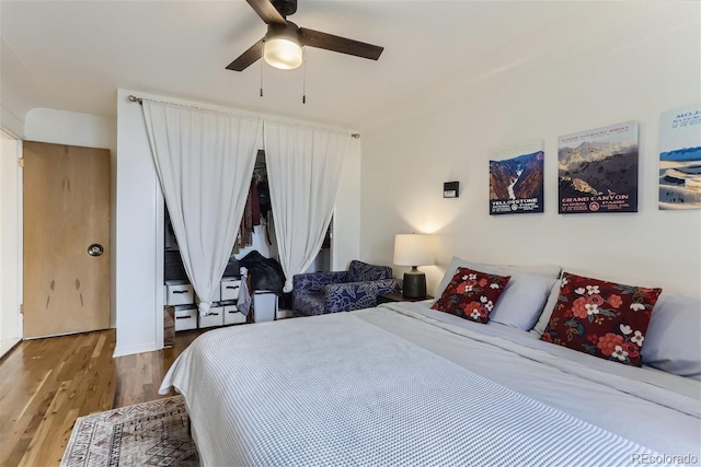 bedroom featuring hardwood / wood-style floors and ceiling fan