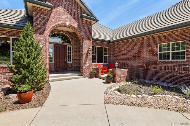 11268 Bell Cross Cir, Parker, CO 80138 - doorway to property featuring brick siding and a tile roof