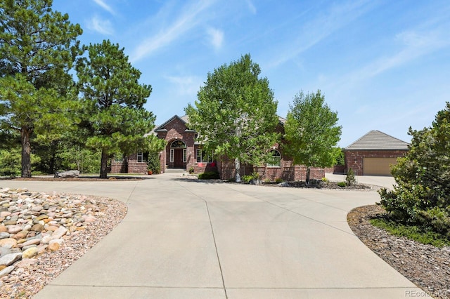 11268 Bell Cross Cir, Parker, CO 80138 - view of front of property featuring curved driveway, brick siding, and a garage