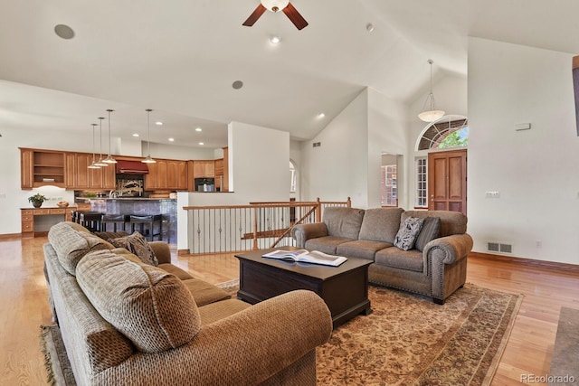 11268 Bell Cross Cir, Parker, CO 80138 - living area featuring ceiling fan, high vaulted ceiling, light wood-style flooring, and recessed lighting