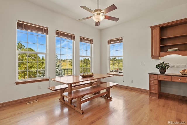 11268 Bell Cross Cir, Parker, CO 80138 - dining area with light wood-style floors and ceiling fan