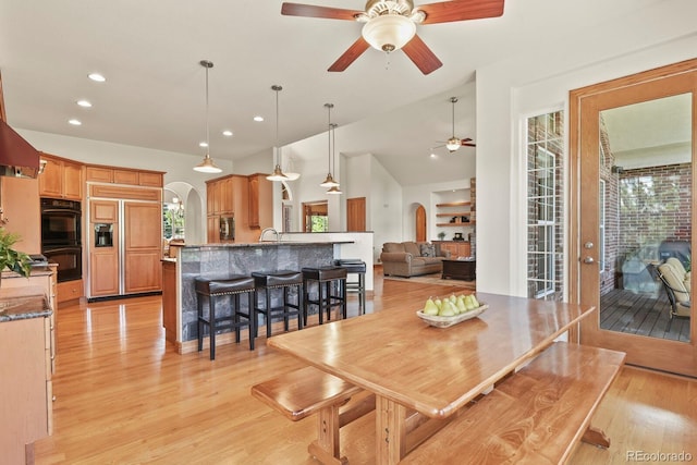 11268 Bell Cross Cir, Parker, CO 80138 - dining area with arched walkways, ceiling fan, plenty of natural light, recessed lighting, and light wood-style flooring