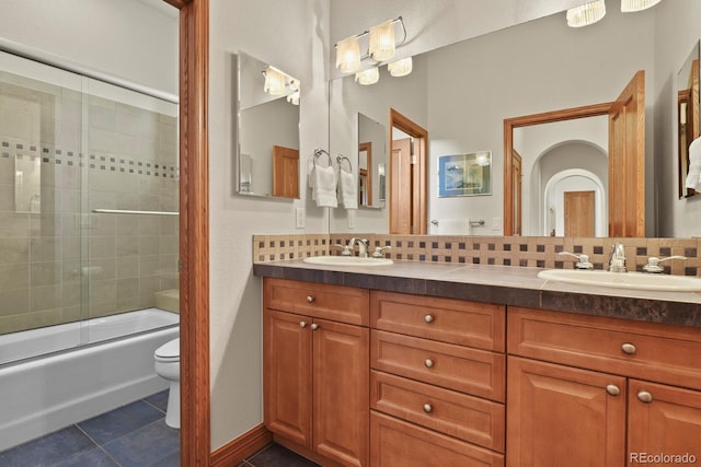 11268 Bell Cross Cir, Parker, CO 80138 - bathroom featuring double vanity, tile patterned floors, and combined bath / shower with glass door
