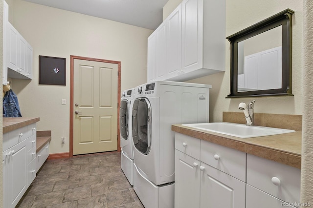 11268 Bell Cross Cir, Parker, CO 80138 - laundry room featuring washer and dryer, cabinet space, and stone finish floors