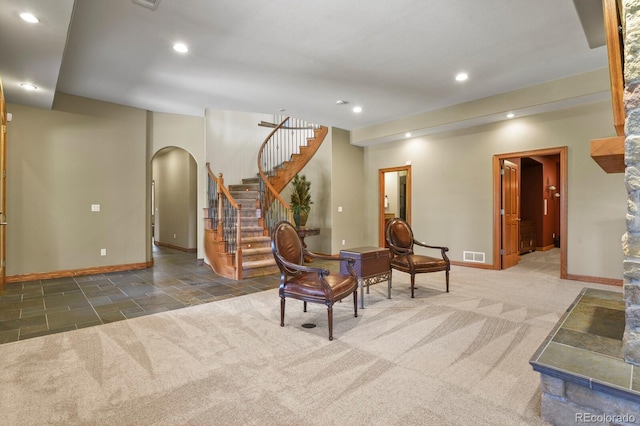 11268 Bell Cross Cir, Parker, CO 80138 - living area with arched walkways, recessed lighting, stairway, and carpet flooring
