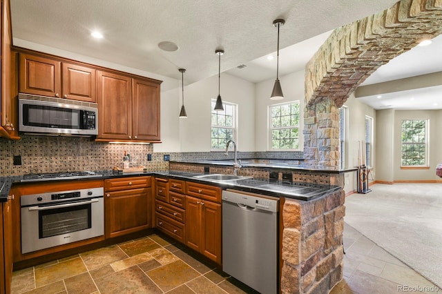 11268 Bell Cross Cir, Parker, CO 80138 - kitchen with appliances with stainless steel finishes, a peninsula, dark countertops, tasteful backsplash, and recessed lighting