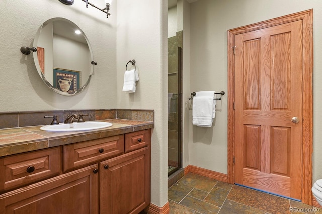 11268 Bell Cross Cir, Parker, CO 80138 - full bathroom with stone tile floors, a shower stall, and vanity