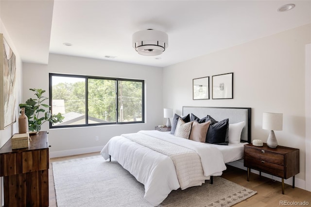 bedroom with light hardwood / wood-style flooring