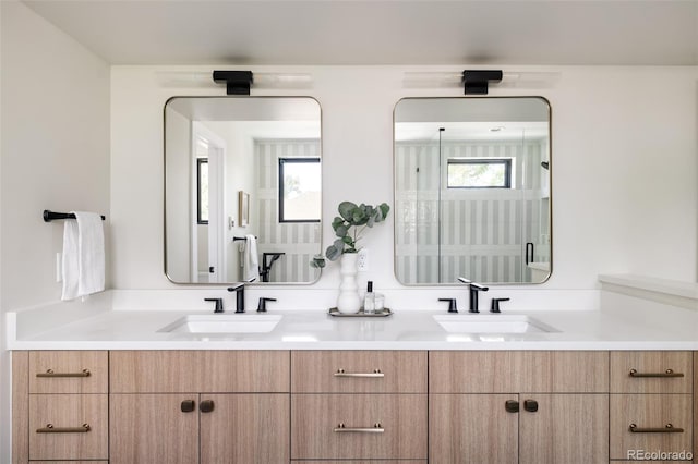 bathroom featuring vanity and a healthy amount of sunlight