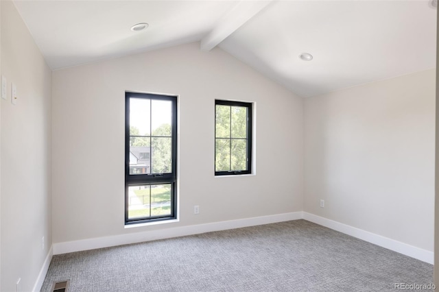 carpeted spare room with vaulted ceiling with beams