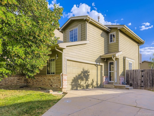 5154 E 126th Ct, Thornton, CO 80241 - traditional home with concrete driveway, an attached garage, and brick siding