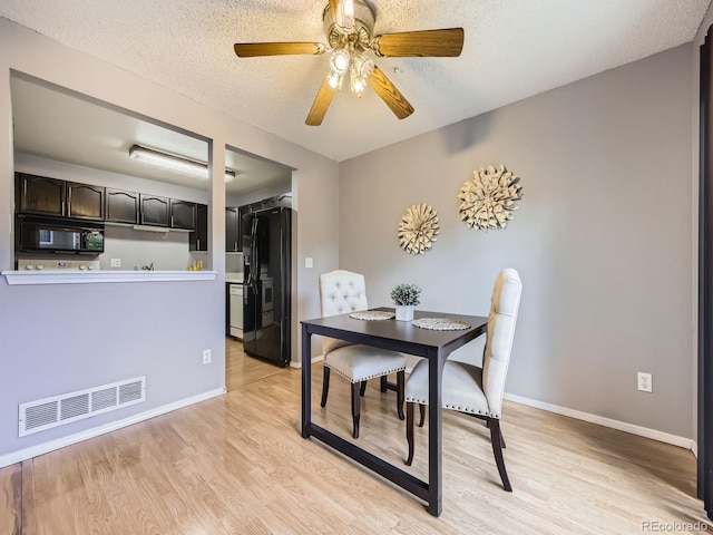 5154 E 126th Ct, Thornton, CO 80241 - dining area with light wood-style flooring, a ceiling fan, and a textured ceiling