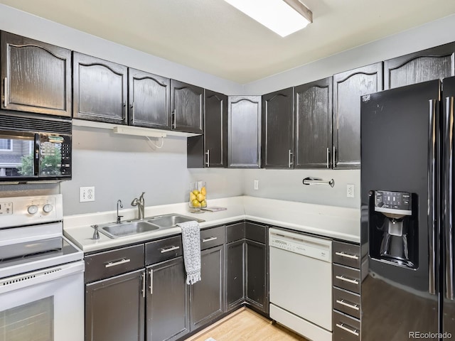5154 E 126th Ct, Thornton, CO 80241 - kitchen featuring black appliances, light countertops, and light wood-style flooring